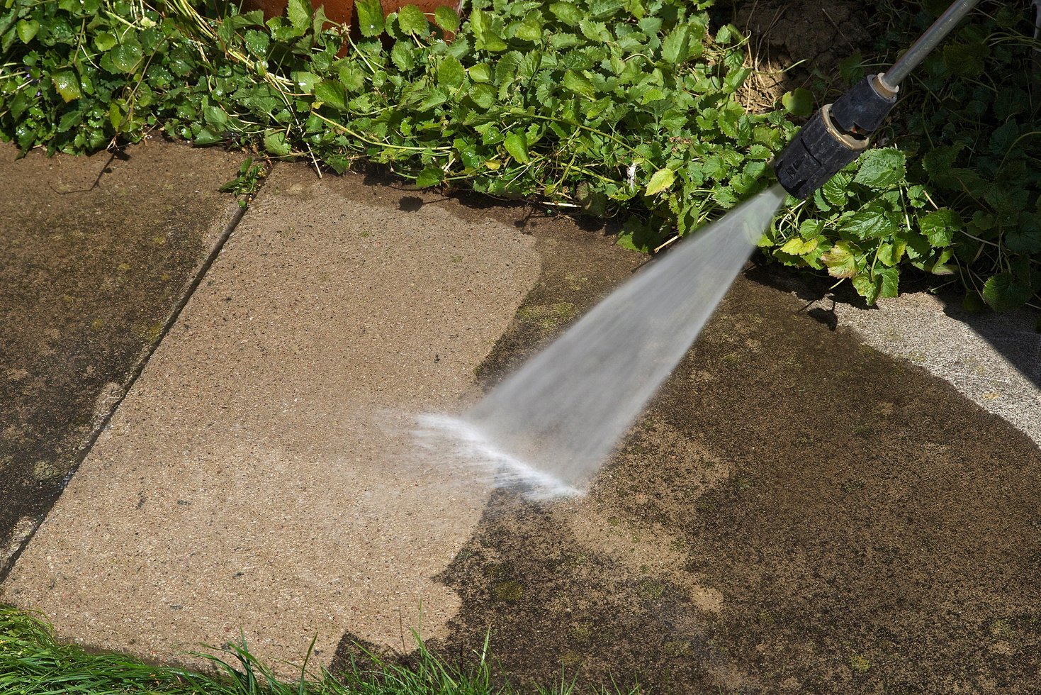 Pressure Washing a Dirty sidewalk